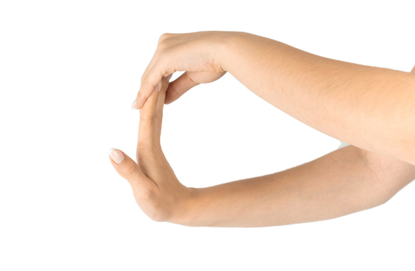 patient performing a wrist and forearm stretch, an example of active therapy used in chiropractic treatment to increase functionality.