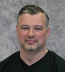 DR. TRAVIS RUSSELL