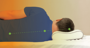 Man laying down with his head properly supported by a pillow