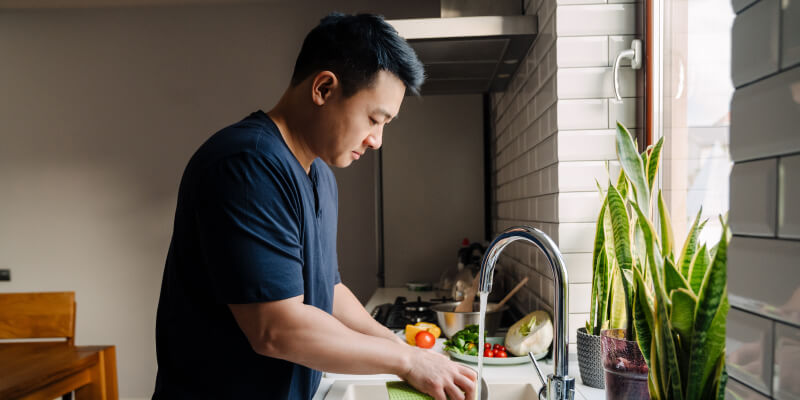 Hunching forward while doing chores can cause back pain