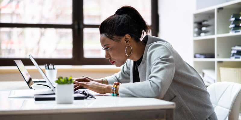 Slouching over electronic devices can cause back pain