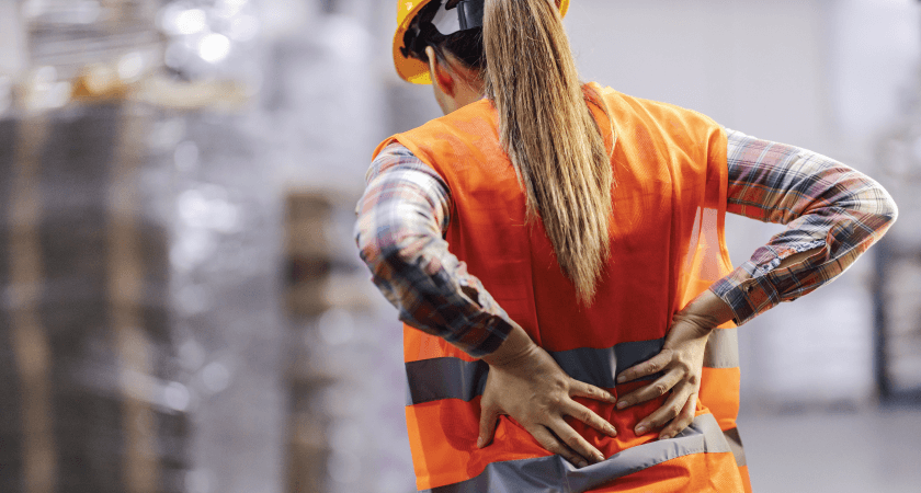 Warehouse, woman worker having low back pain