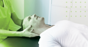 Man on table being adjusted by chiropractor