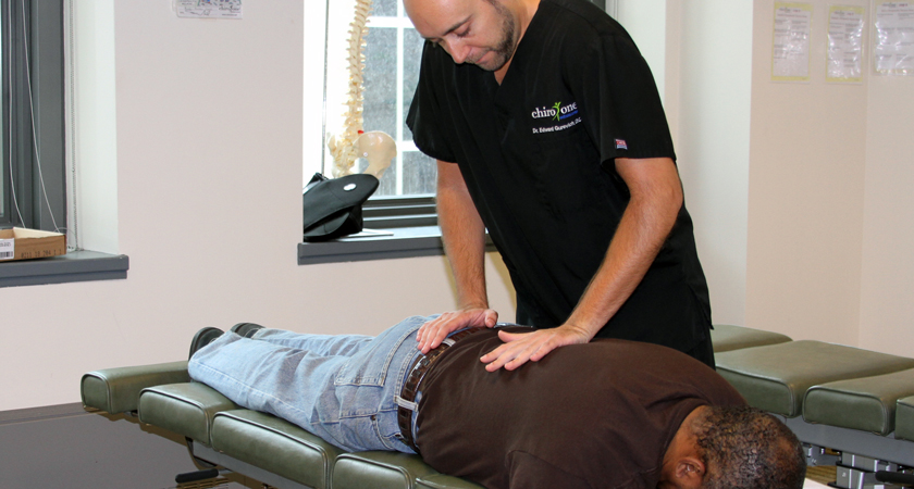 Chiropractor performing an adjustment