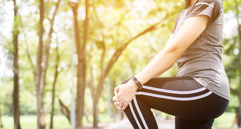 Woman stretching at a park