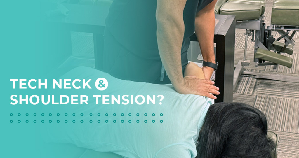 A chiropractor performing a manual adjustment on a patient's upper back